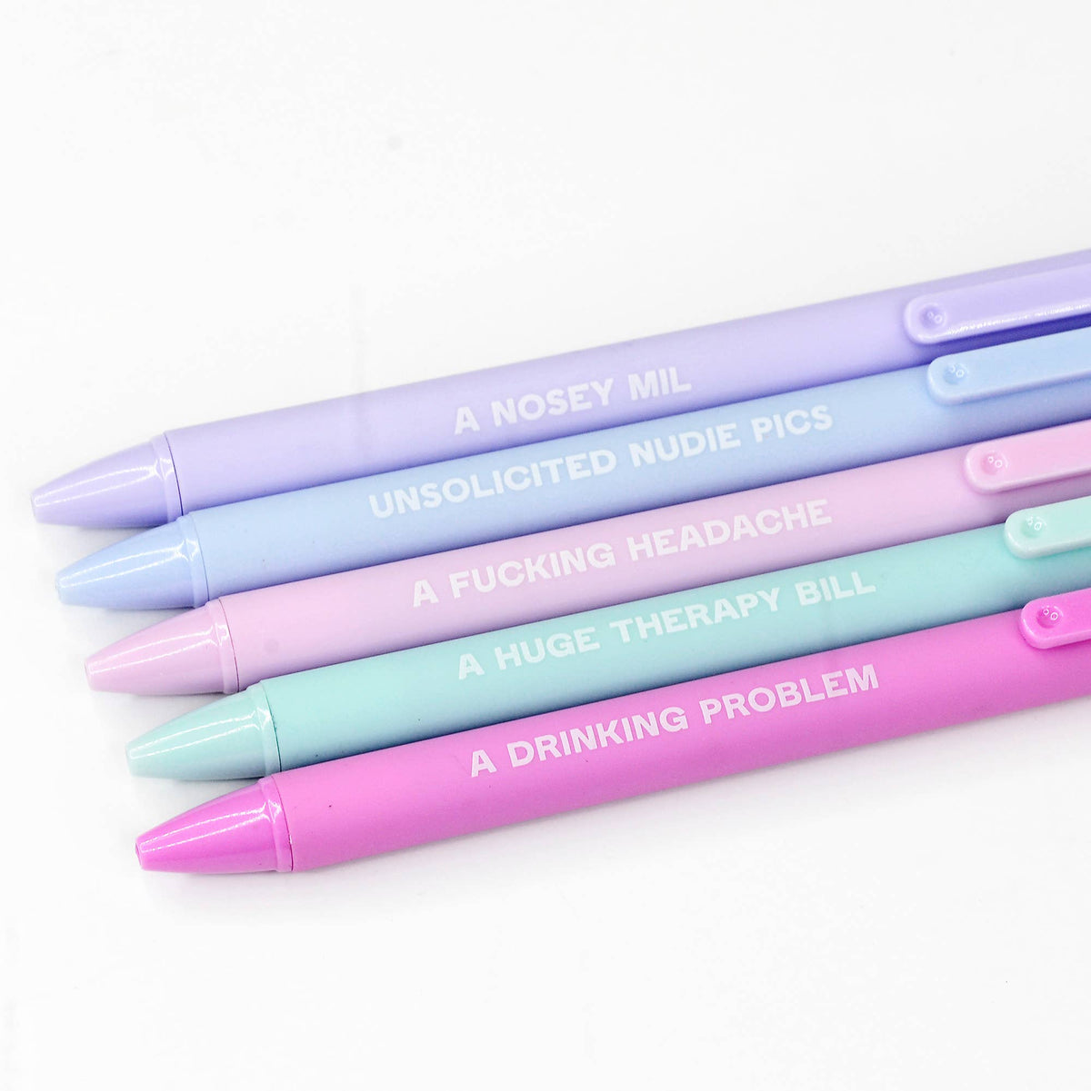 A set of 5 multicolored soft touch pens with black gel ink, each pen has a different color and a humorous phrase printed on the top.